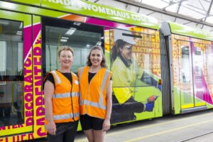 colourful tram and tradeswoman